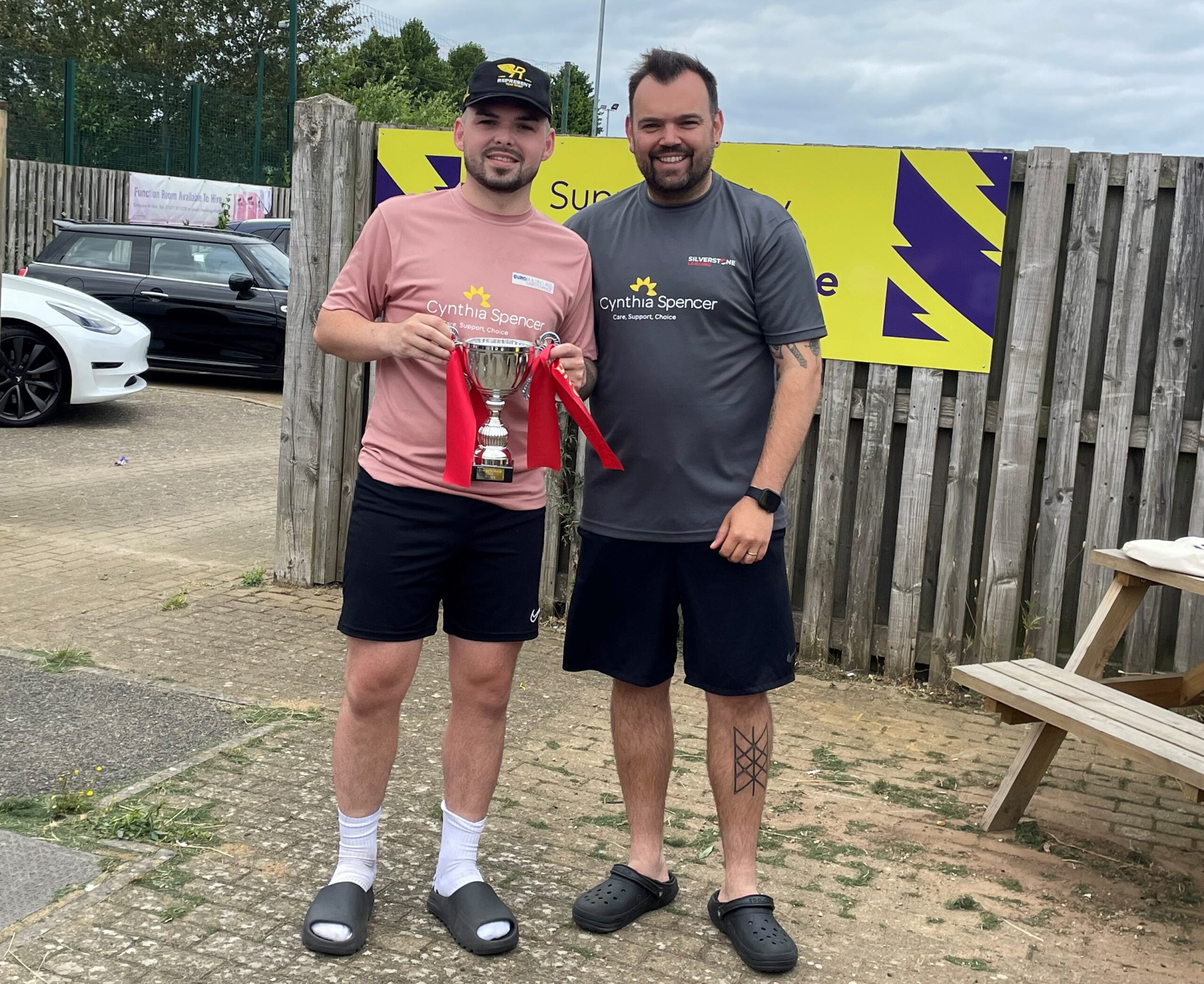 Silverstone Leasing's Ryan Bishop (right) presents the winner's trophy to Ollie Emery