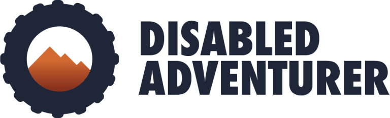 Logo with a mountain inside a gear-shaped circle, next to bold text reading Disabled Adventurer.